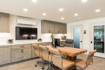A modern kitchen with a wooden table and chairs.at 3TEN, Springfield, 62704